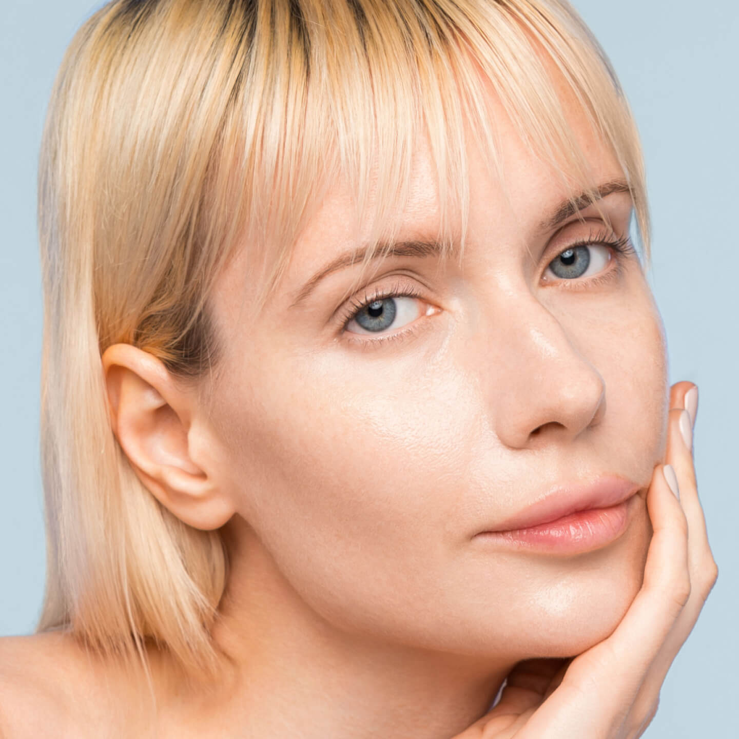 A woman's face after applying the serum