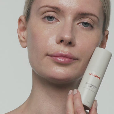 A woman applying the serum